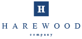 Das Logo besteht aus einem blauen Quadrat mit einem weißen „H“ im Inneren, gefolgt vom Text „HAREWOOD COMPANY“ in Blau.